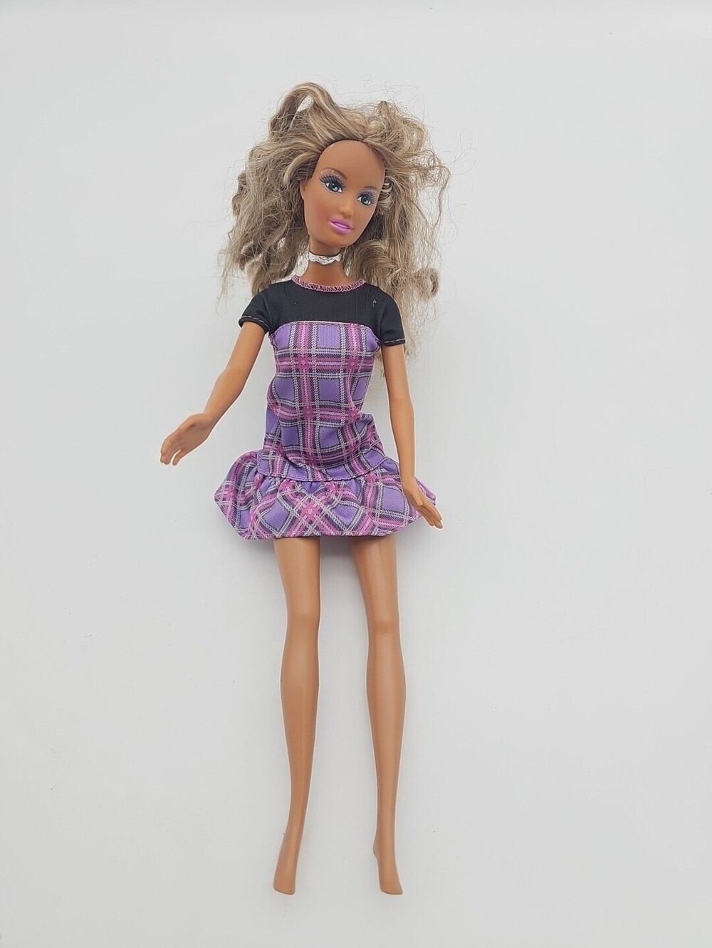 Barbie Pre-owned #137 doll. Includes original plaid dress Used Condition